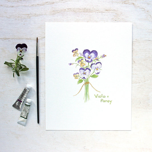 Pansy and Viola Watercolor Print by Kathleen Maunder of Trowel and Paintbrush. Delicate painting of a bouquet of purple pansies and yellow violas.