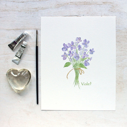 Art print featuring a delicate watercolor painting of a small bouquet of violets tied with a string. Artist Kathleen Maunder.