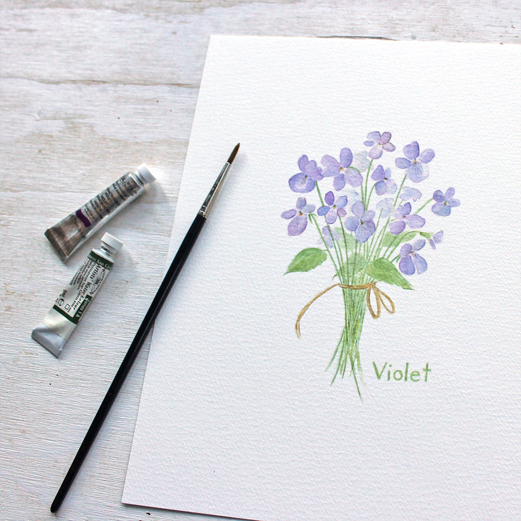 Art print featuring a delicate watercolor painting of a small bouquet of violets tied with a string. Artist Kathleen Maunder.