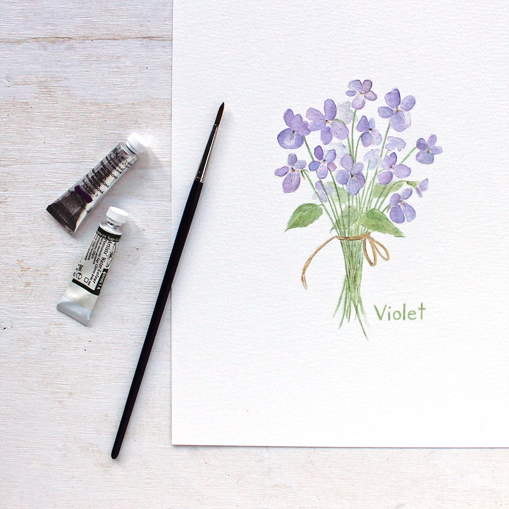 Art print featuring a delicate watercolor painting of a small bouquet of violets tied with a string. Artist Kathleen Maunder.