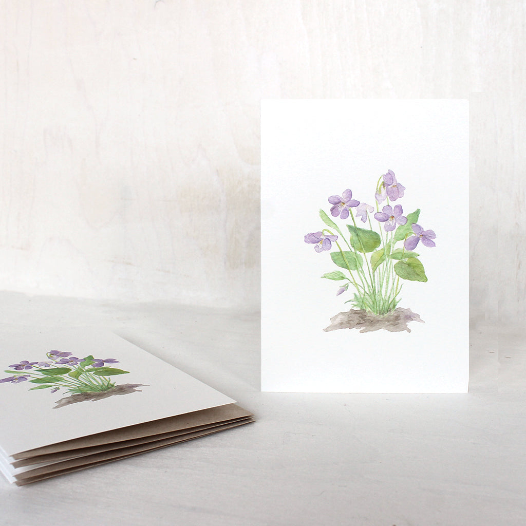 Note cards featuring a delicate painting of light purple wood violets by watercolor artist Kathleen Maunder