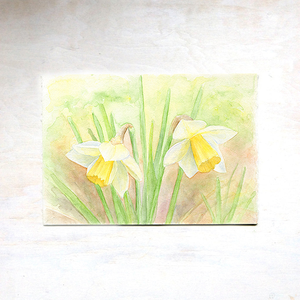An original watercolour painting of two yellow daffodils. Artist Kathleen Maunder.