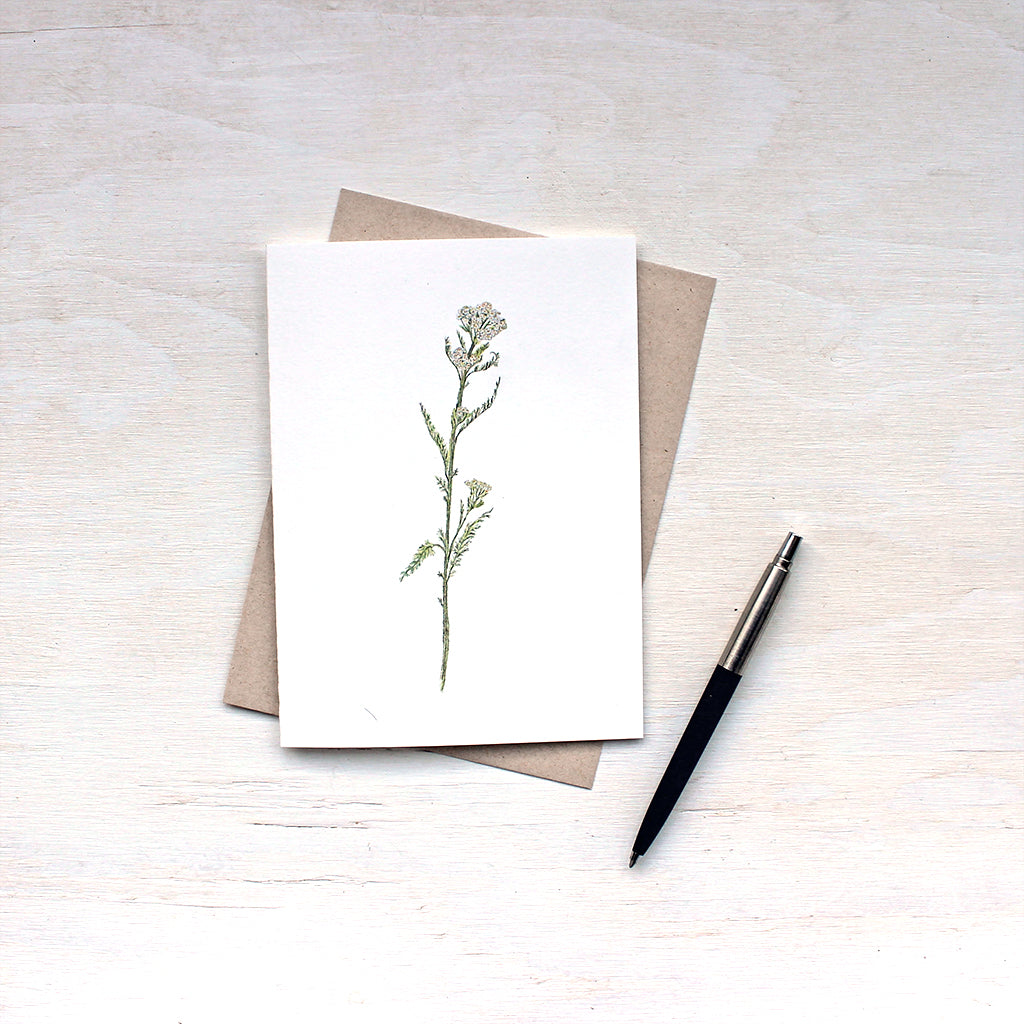 White yarrow note card and recycled kraft envelope featuring a watercolor by Kathleen Maunder