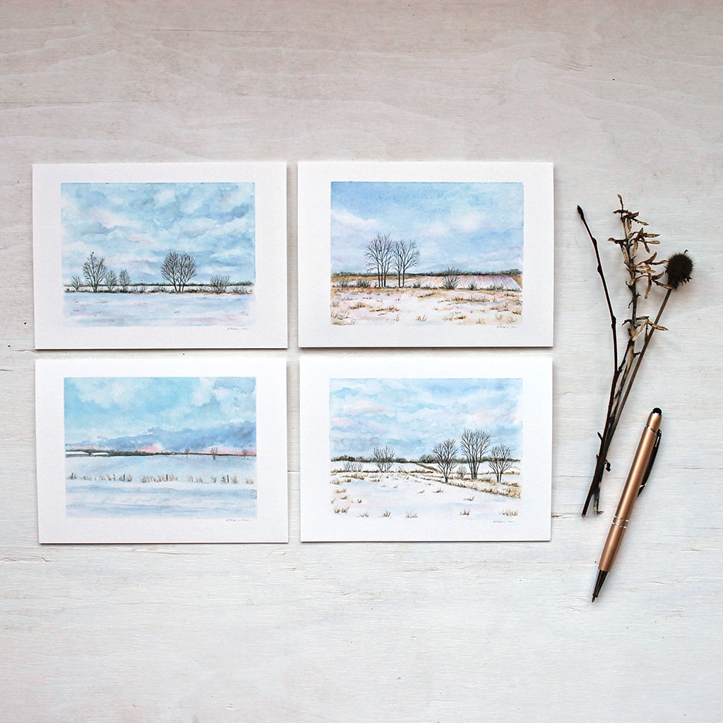 Note card collection featuring four different rural winter landscape paintings by watercolor artist Kathleen Maunder. 