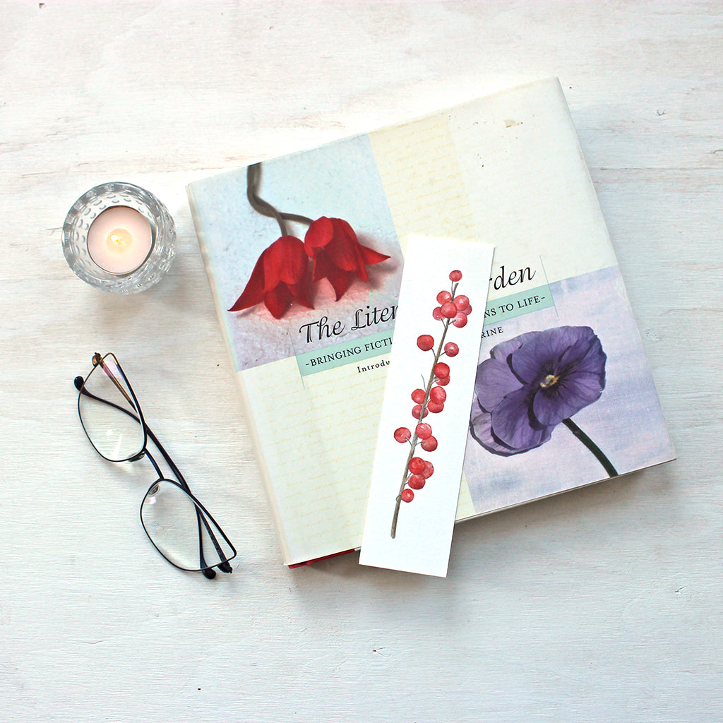 Bookmark featuring a watercolour painting of a winterberry sprig by artist Kathleen Maunder 