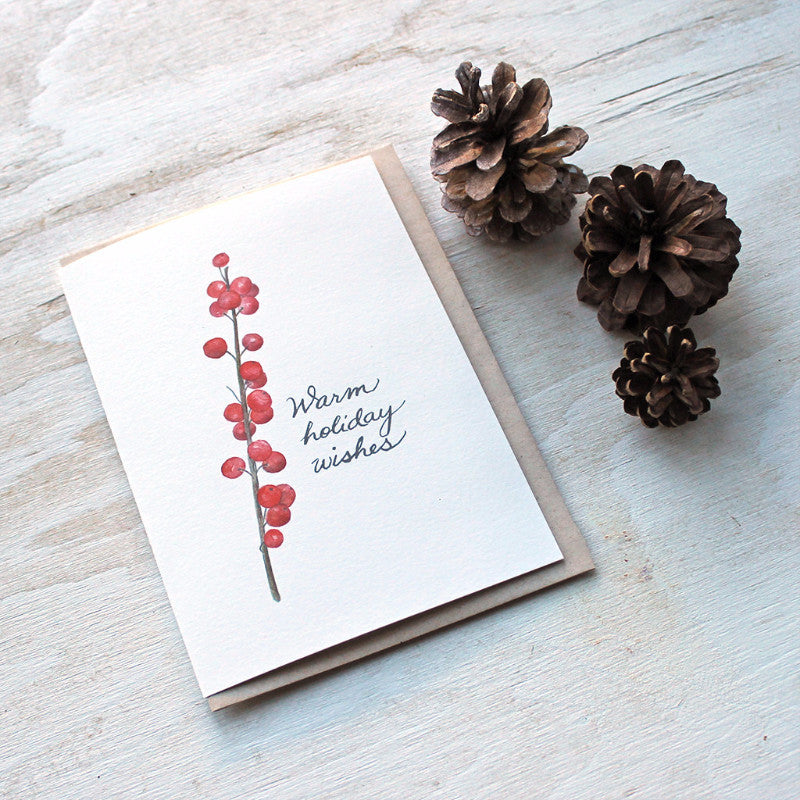 This lovely holiday note card features a watercolor image of a twig of bright red winterberries. Painting by Kathleen Maunder of Trowel and Paintbrush.